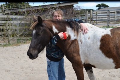 Ocracoke Pony Volunteer Sherry Atkinson and one of her favorite Ocracoke ponies, Easter Lady.